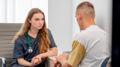 Behavioral health clinician talking to patient during consultation